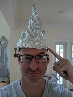tinfoil hat pointing at hat